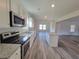 Bright kitchen with stainless steel appliances, and a modern island perfect for gatherings at 28 Loth Wages (Lot 28) Rd, Dacula, GA 30019