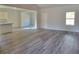 Open-concept living area with stylish flooring, seamlessly connected to the kitchen at 28 Loth Wages (Lot 28) Rd, Dacula, GA 30019