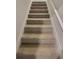 Carpeted stairway leading to upper level provides safe passage and classic look at 28 Loth Wages (Lot 28) Rd, Dacula, GA 30019