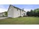 Spacious backyard featuring a well-maintained lawn and a wooden deck, perfect for outdoor entertaining and relaxation at 4914 Brown Leaf Dr, Powder Springs, GA 30127