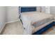Cozy bedroom featuring a blue accent bed frame and plush carpet at 4914 Brown Leaf Dr, Powder Springs, GA 30127