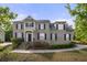 Charming brick home with well-maintained landscaping and a welcoming entrance at 4914 Brown Leaf Dr, Powder Springs, GA 30127