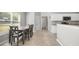Bright breakfast nook with a gray wood table set by a large window at 4914 Brown Leaf Dr, Powder Springs, GA 30127