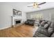 Spacious living room featuring a fireplace, hardwood floors and lots of natural light at 4914 Brown Leaf Dr, Powder Springs, GA 30127