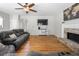 Comfortable living room featuring hardwood floors, a fireplace, and modern decor at 4914 Brown Leaf Dr, Powder Springs, GA 30127
