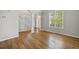 Living room with hardwood floors, archways, and staircase at 4914 Brown Leaf Dr, Powder Springs, GA 30127