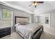 Spacious main bedroom with a tray ceiling and natural light at 4914 Brown Leaf Dr, Powder Springs, GA 30127