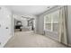 Large main bedroom with a tray ceiling, bedroom entrance and large window at 4914 Brown Leaf Dr, Powder Springs, GA 30127