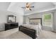 Spacious main bedroom featuring a tray ceiling and carpet at 4914 Brown Leaf Dr, Powder Springs, GA 30127