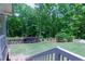 Spacious backyard featuring lush greenery, white picket fence and shade trees at 5045 Huntwood Way, Roswell, GA 30075