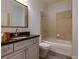 Well-lit bathroom with granite countertop, frosted glass shower door, and modern toilet at 5045 Huntwood Way, Roswell, GA 30075