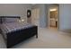 Comfortable bedroom with soft carpet, ample closet space, and an ensuite bathroom at 5045 Huntwood Way, Roswell, GA 30075
