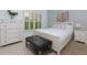 Bright bedroom with a window, a dresser, and a comfortable bed with plush pillows at 5045 Huntwood Way, Roswell, GA 30075