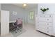 Bright room with a work area and a dresser and a serene view of the outdoors at 5045 Huntwood Way, Roswell, GA 30075