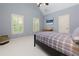 Well-lit bedroom features two windows with views and complementing wall decor at 5045 Huntwood Way, Roswell, GA 30075
