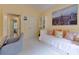 Serene, light-filled bedroom provides an inviting work space with a comfortable daybed and ample storage at 5045 Huntwood Way, Roswell, GA 30075
