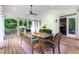 Covered porch featuring outdoor seating, a ceiling fan, and a view of the backyard at 5045 Huntwood Way, Roswell, GA 30075