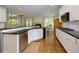 Open kitchen features granite countertops, stainless steel appliances, and hardwood flooring at 5045 Huntwood Way, Roswell, GA 30075