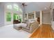 Bright living room featuring large windows and hardwood floors at 5045 Huntwood Way, Roswell, GA 30075