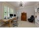 Bright and airy office space with two computer monitors and comfortable furniture at 5045 Huntwood Way, Roswell, GA 30075