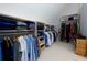 Spacious walk-in closet with custom shelving and ample storage space for clothes and accessories at 5045 Huntwood Way, Roswell, GA 30075
