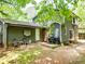 Backyard space with patio, seating, and lush greenery, ideal for relaxing and entertaining guests at 555 Creekwood Xing, Roswell, GA 30076