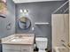 Charming bathroom featuring a granite vanity top, matching mirror, and a clean, bright shower and tub at 555 Creekwood Xing, Roswell, GA 30076