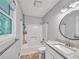Bright bathroom with a modern vanity, shower, and window provides a functional and pleasant space at 555 Creekwood Xing, Roswell, GA 30076