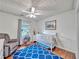 Cozy Bedroom with a crib, recliner, and bright rug provides a comfortable space for the little one at 555 Creekwood Xing, Roswell, GA 30076