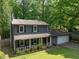 Charming two-story home with a welcoming front porch and well-manicured lawn provides great curb appeal at 555 Creekwood Xing, Roswell, GA 30076