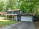 Charming two-story home with a welcoming front porch and well-manicured lawn provides great curb appeal at 555 Creekwood Xing, Roswell, GA 30076