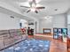 Open-concept living room with hardwood floors, recessed lighting, and comfortable seating perfect for entertaining at 555 Creekwood Xing, Roswell, GA 30076