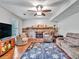 Inviting living room with stone fireplace, plush seating, and hardwood floors creating a cozy atmosphere at 555 Creekwood Xing, Roswell, GA 30076
