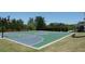 Community basketball court featuring a well-maintained surface and basketball hoops for sports activities at 5753 Brendlynn Dr, Suwanee, GA 30024