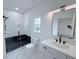 Elegant bathroom features a modern vanity, a sleek glass shower, and stylish fixtures at 5753 Brendlynn Dr, Suwanee, GA 30024