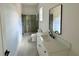Bathroom featuring shower with glass door and white vanity at 5753 Brendlynn Dr, Suwanee, GA 30024
