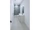 Modern bathroom featuring a glass-enclosed shower, vanity with dark fixtures, and neutral color palette at 5753 Brendlynn Dr, Suwanee, GA 30024