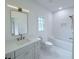 Bathroom featuring a single vanity, updated fixtures, and tile flooring at 5753 Brendlynn Dr, Suwanee, GA 30024