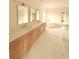 Bright bathroom featuring double vanity, marble floors, and modern fixtures at 5753 Brendlynn Dr, Suwanee, GA 30024