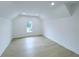Bright bedroom with hardwood floors, recessed lighting, and a window view at 5753 Brendlynn Dr, Suwanee, GA 30024