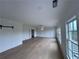 Large bedroom features hardwood floors, trim accent wall, and windows that provide plenty of natural light at 5753 Brendlynn Dr, Suwanee, GA 30024