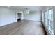 Spacious bedroom featuring designer chandelier, and large windows providing lots of natural light at 5753 Brendlynn Dr, Suwanee, GA 30024
