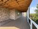 Expansive deck with wood flooring and exposed ceiling, ideal for outdoor relaxation and entertainment at 5753 Brendlynn Dr, Suwanee, GA 30024