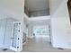 Open foyer with clerestory and light wood floors leading to spacious interior at 5753 Brendlynn Dr, Suwanee, GA 30024