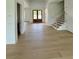 Entryway with hardwood floors and a staircase at 5753 Brendlynn Dr, Suwanee, GA 30024