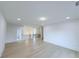 Hallway with modern black iron banister and hardwood floors at 5753 Brendlynn Dr, Suwanee, GA 30024