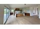 Spacious kitchen with a large center island, stainless steel appliances, and sliding doors to an outdoor deck at 5753 Brendlynn Dr, Suwanee, GA 30024