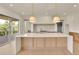 Stylish kitchen island with countertop and modern pendant lighting above at 5753 Brendlynn Dr, Suwanee, GA 30024