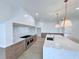 Modern kitchen with large island, professional range, and custom cabinets at 5753 Brendlynn Dr, Suwanee, GA 30024