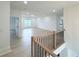 Open-concept living space with staircase, hardwood floors, and natural lighting at 5753 Brendlynn Dr, Suwanee, GA 30024
